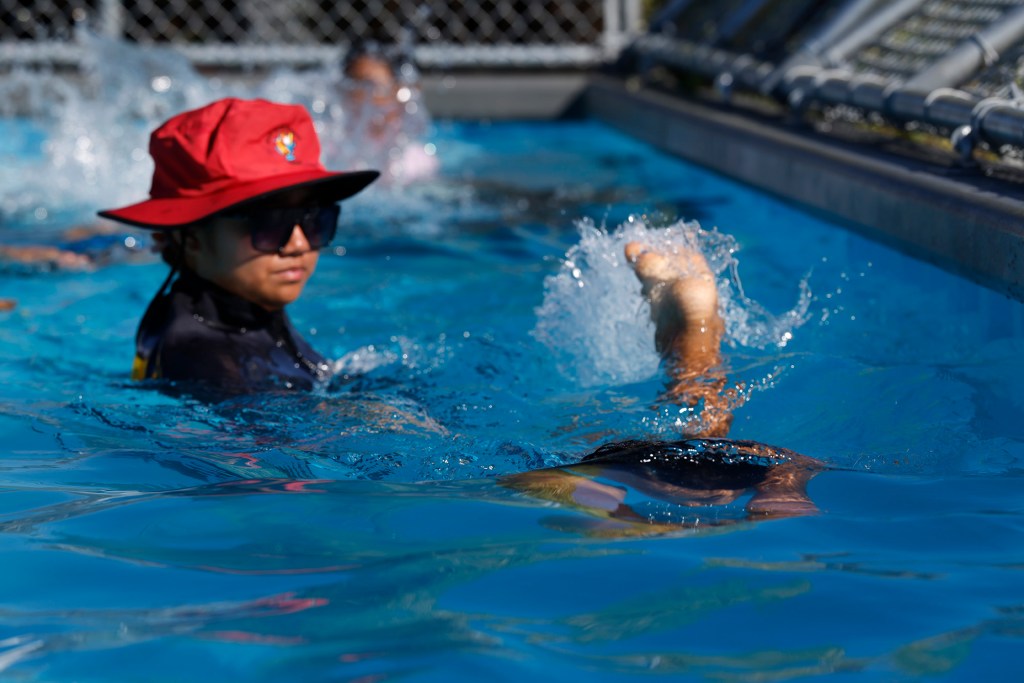 Na Kama Kai students practice swimming in the mobile pool Monday, Oct. 26, 2026, in Waiʻanae. (Kevin Fujii/Civil Beat/2026)