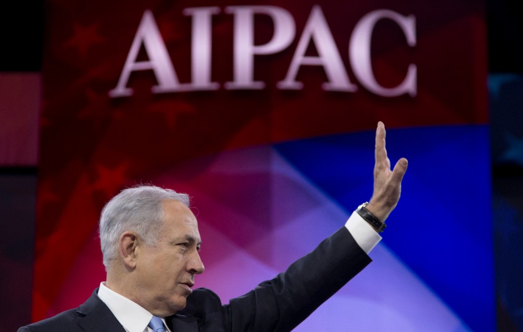 Israeli Prime Minister Benjamin Netanyahu waves to the cheering audience as he arrives to speak to the AIPAC meeting at the Washington Convention Center, Tuesday, March 4, 2014, in Washington. (AP Photo/Carolyn Kaster)