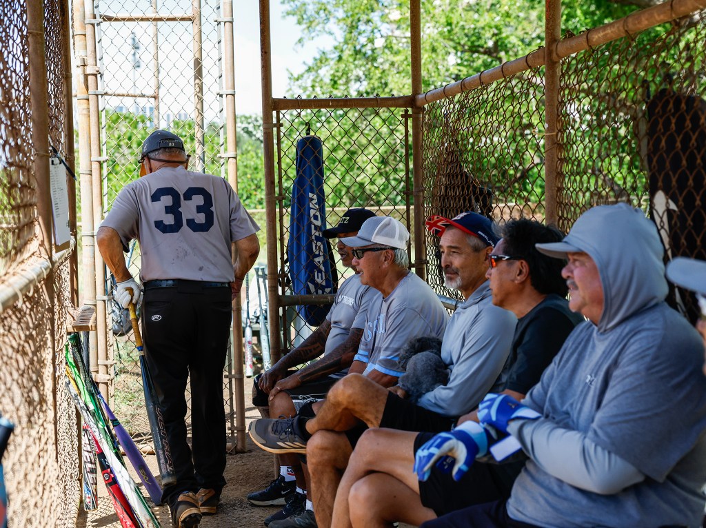Francis Lum (33) prepares to bat during a softball game, Monday, Oct. 5, 2026, in Mōʻiliʻili. Lum plays three times a week along with batting practice on Tuesdays.  (Jamm Aquino/Civil Beat/2026)